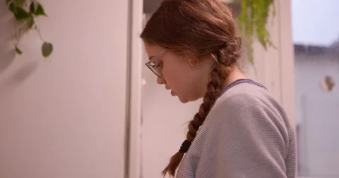 A young person with a thoughtful expression is captured in a close-up. Stock Footage 331399233