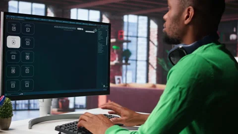 Young person uses software combining data and machine learning Stock Footage 307797979