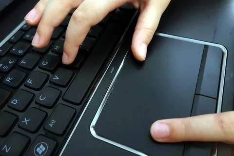Young person using laptop computer Stock Photos