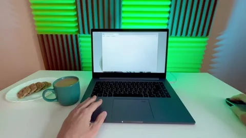 A young person, a writer or programmer, sits down at a computer and writes a tex Stock Footage 238031124