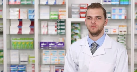 Young Pharmacist Man Negative No Answer Looking Interview Refuse Talk Pharmacy Stock Footage 77003301