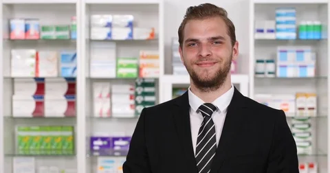 Young Pharmacist Man Showing Presentation Thumb Up Sign Camera Pharmacy Interior Stock Footage 76995369