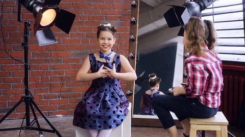 Young photographer working with a young model Video stock 105036583