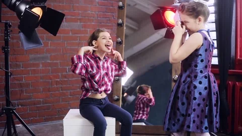 Young photographer working with a young model Stock Footage 150364062
