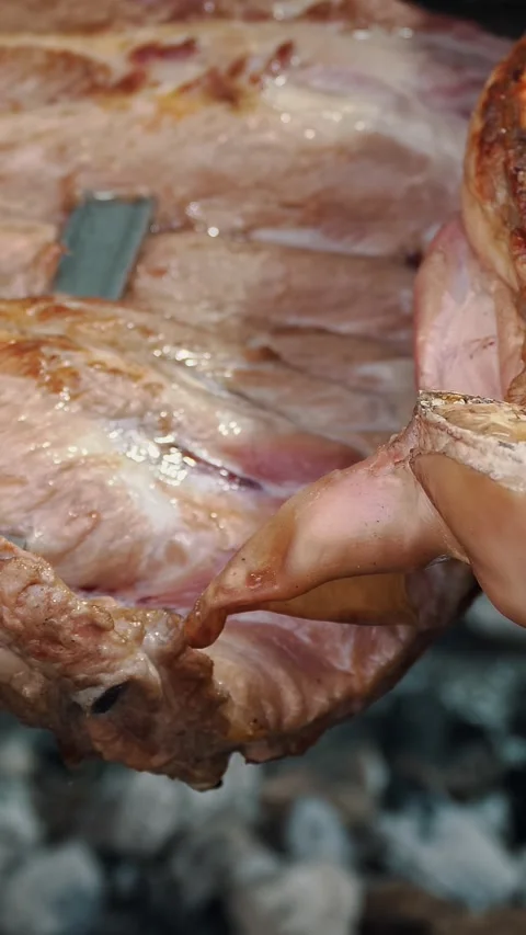 Young piglets are roasted. fried meat, juicy pork. close-up. roast suckling pig Stock Footage 322512978