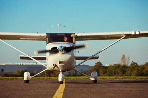 Young pilot is preparing for take off with private plane. 스톡 사진