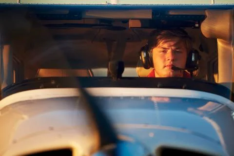 Young pilot is preparing for take off with private plane. Stock-Fotos