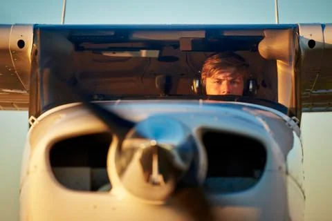 Young pilot is preparing for take off with private plane. Foto stock