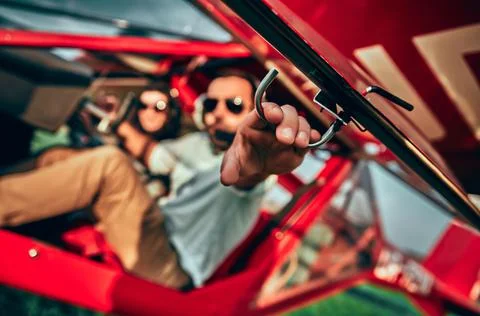 Young pilot is preparing for take off in private plane. Stock Photos