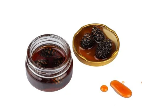 Young pine cones jam in a jar Stock Photos