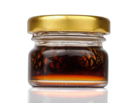 Young pine cones jam in a jar Stock Photos