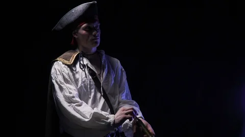 A young pirate in cocked hat is using a spyglass, amazing 4k shot Stock Footage 105396875