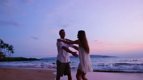 Young Playfull Couple on Beach Stock Footage 52552176