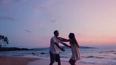 Young Playfull Couple on Beach Stock-Footage 52552311