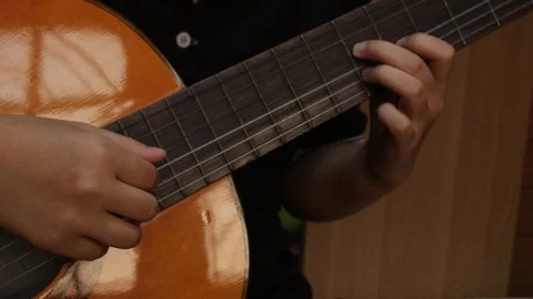 Young playing guitar. Stock Footage 106871920