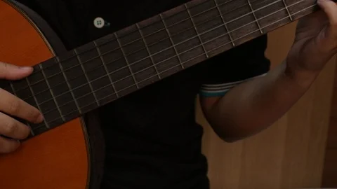Young playing guitar. Stock Footage 106871969