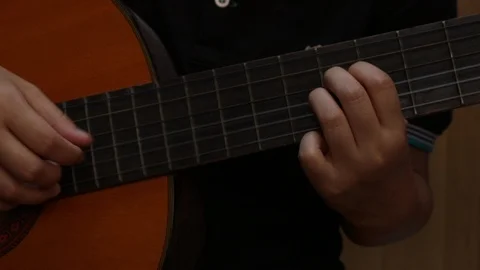 Young playing guitar. Stock Footage 106872036