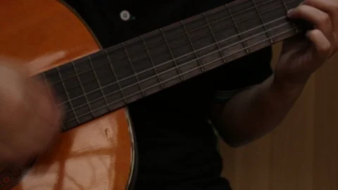 Young playing guitar. Stock Footage 106872094