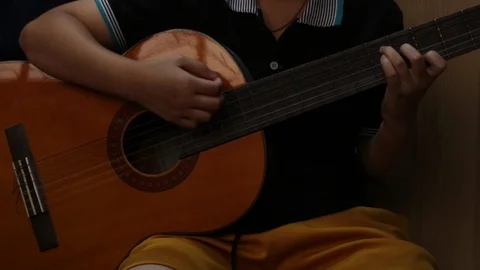 Young playing guitar. Stock Footage 106872095