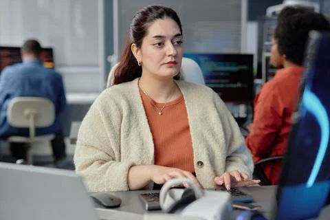 Young Plus Size Programmer Typing on Keyboard Fixing Errors Stock Photos