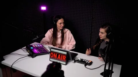 Young podcaster interviewing guest in modern studio Stock Footage 246729817