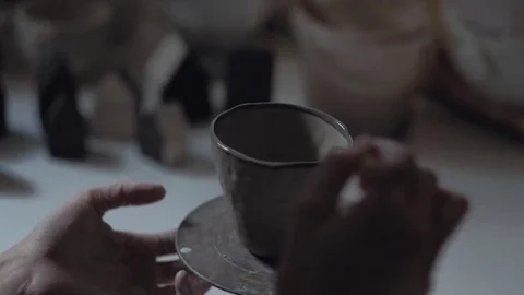 Young Potter Works in Workshop, Paints Mug, Close-Up Shot Hands of Potter Stock Footage 76567801