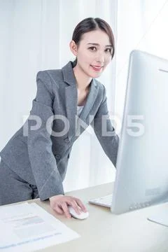 Young Pretty Business Woman With Notebook In The Office