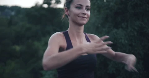 Young pretty female dancer practising in nature 4K Stock Footage 54838662