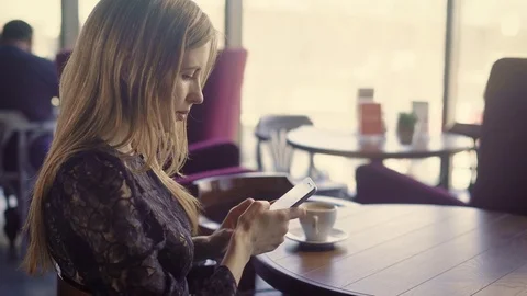 Young pretty female using phone. Young attractive female in elegant dress Stock Footage 75706115