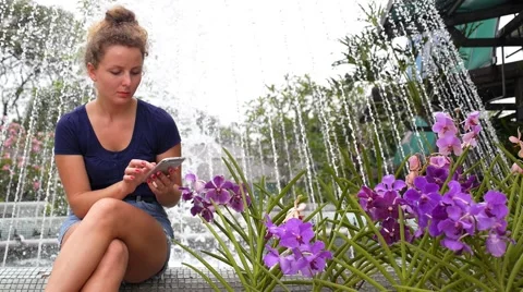 Young Pretty Girl Using Mobile Phone in Summer Park. Stock Footage 49507463