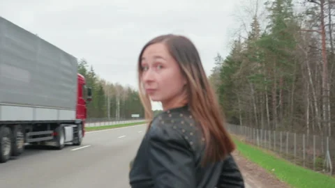 Young, pretty road prostitute goes along the road Stock Footage 88838200
