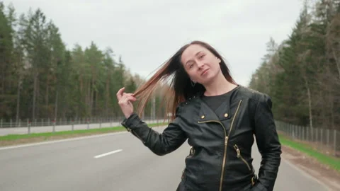 Young, pretty road prostitute goes along the road Stock Footage 88839647