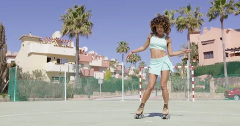 Young pretty woman dancing in roller skates Stock Footage
