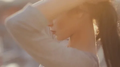 Young pretty woman posing and flirting at sunset Stock Footage