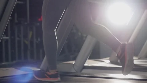 Young pretty woman running on treadmill Stock Footage 74622853