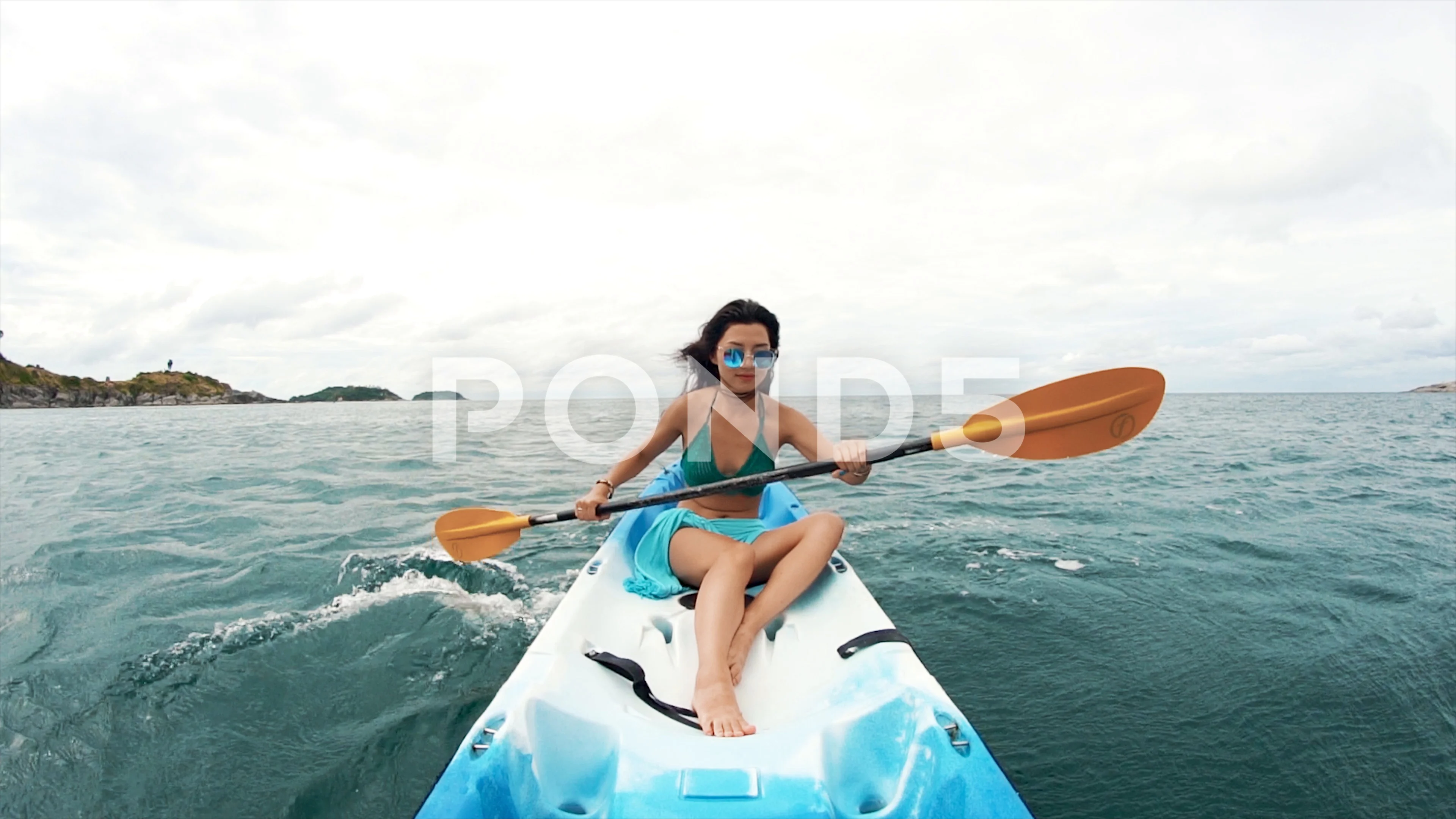 https://images.pond5.com/young-pretty-woman-sunglasses-rowing-072525004_prevstill.jpeg