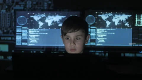 Young prodigy boy hacker programmer working at the computer in the data center Stock Footage 86443568