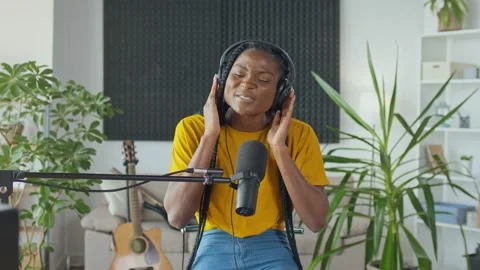 A Young Professional African Singer Performs a New Song Into a Microphone Stock-Footage 163461537