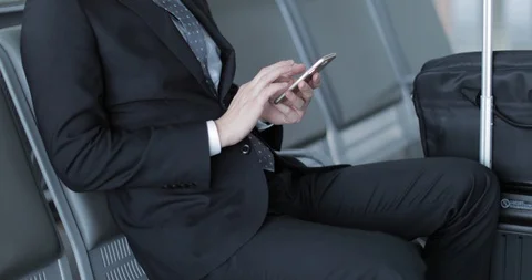 Young professional and elegant Japanese businessman at the airport Stock Footage 127614853
