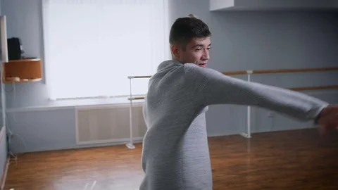 Young professional dancer performs contempo dance in large dance studio. Train Stock Footage 70365737