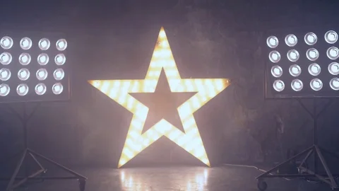 A young professional dancer performs a fast number on stage in the light of the Stock Footage 81710517