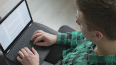 Young professional doing his work project at home} Stock Footage 142769998