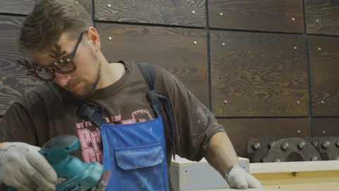 Young professional is doing repairs with appliance in photo studio. Video stock 85624305