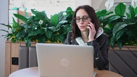 Young professional female manager using laptop in mall, businesswoman working Stock Footage 191581060