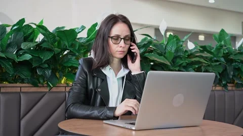 Young professional female manager using laptop in mall, businesswoman working Stock Footage 192259367