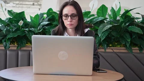 Young professional female manager using laptop in mall, businesswoman working Stock Footage 193529187