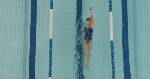 Young professional female swimmer swims ... | Stock Video | Pond5