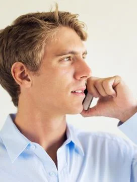 Young professional, handsome man using smart mobile phone Stock Photos
