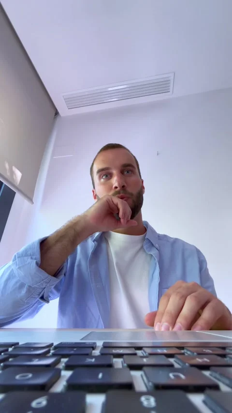 Young professional man working from home, talking and gesturing during an Stock Footage 344787291