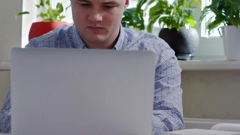 Young professional man working in an office Stock Footage 125897549